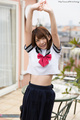 Mari rika stretching outdoors in uniform