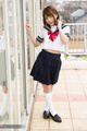 Legs crossed wearing kogal uniform