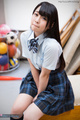 Student minano ai seated in gym