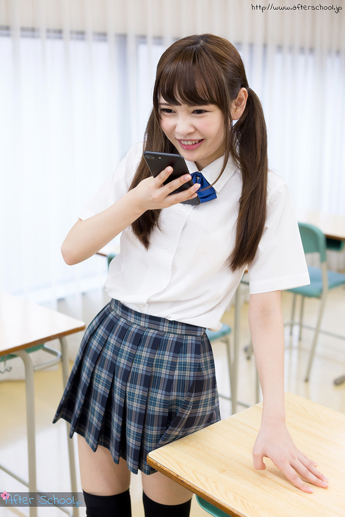 Student atomi shuri standing in classroom hair in pigtails wearing uniform