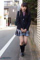 Student walking outdoors in uniform