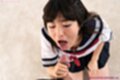 On her knees stroking cock in uniform mouth open tongue out