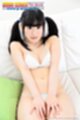 Yui kyono sitting back on couch hair in pigtails wearing pale blue bikini hands resting between her thighs