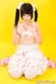 Shinjo nozomi kneeling hair in pigtails dress lowered hands over her bra