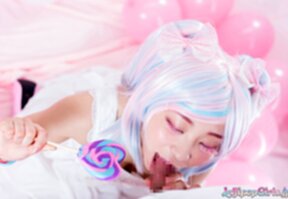 Minano Ai on her knees sucking lolipop and cock