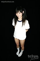 Kawai Anri in gym class uniform hands behind her back long hair in pigtails