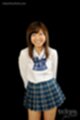 Kogal in uniform hands clasped behind her back
